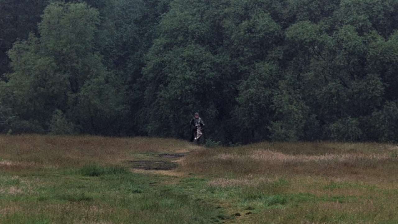 Screenshot of far-away Sir Lancelot running towards the camera from Monty Python and the Holy Grail