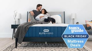 Image shows the Bear Elite Hybrid Mattress with a couple sitting on top talking, plus a Black Friday mattress sales badge overlaid in blue