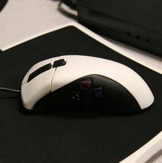The FragFX mouse has four PlayStation controller buttons of the left side of the device.
