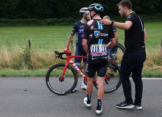 Team DSM teams American rider Kevin Vermaerke receives assistance after suffering a crash during the 8th stage of the 109th edition of the of the Tour de France cycling race 1863 km between Dole in eastern France and Lausanne in Switzerland on July 9 2022 Photo by Thomas SAMSON AFP Photo by THOMAS SAMSONAFP via Getty Images