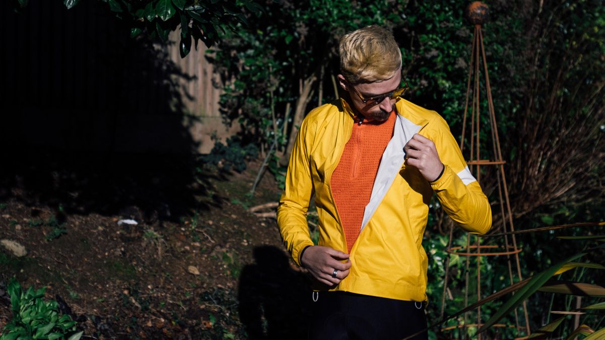 A yellow rapha core waterproof jacket
