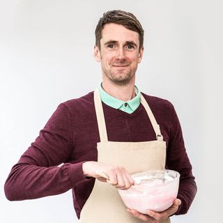 bake off contestant with maroon t-shirt and apron