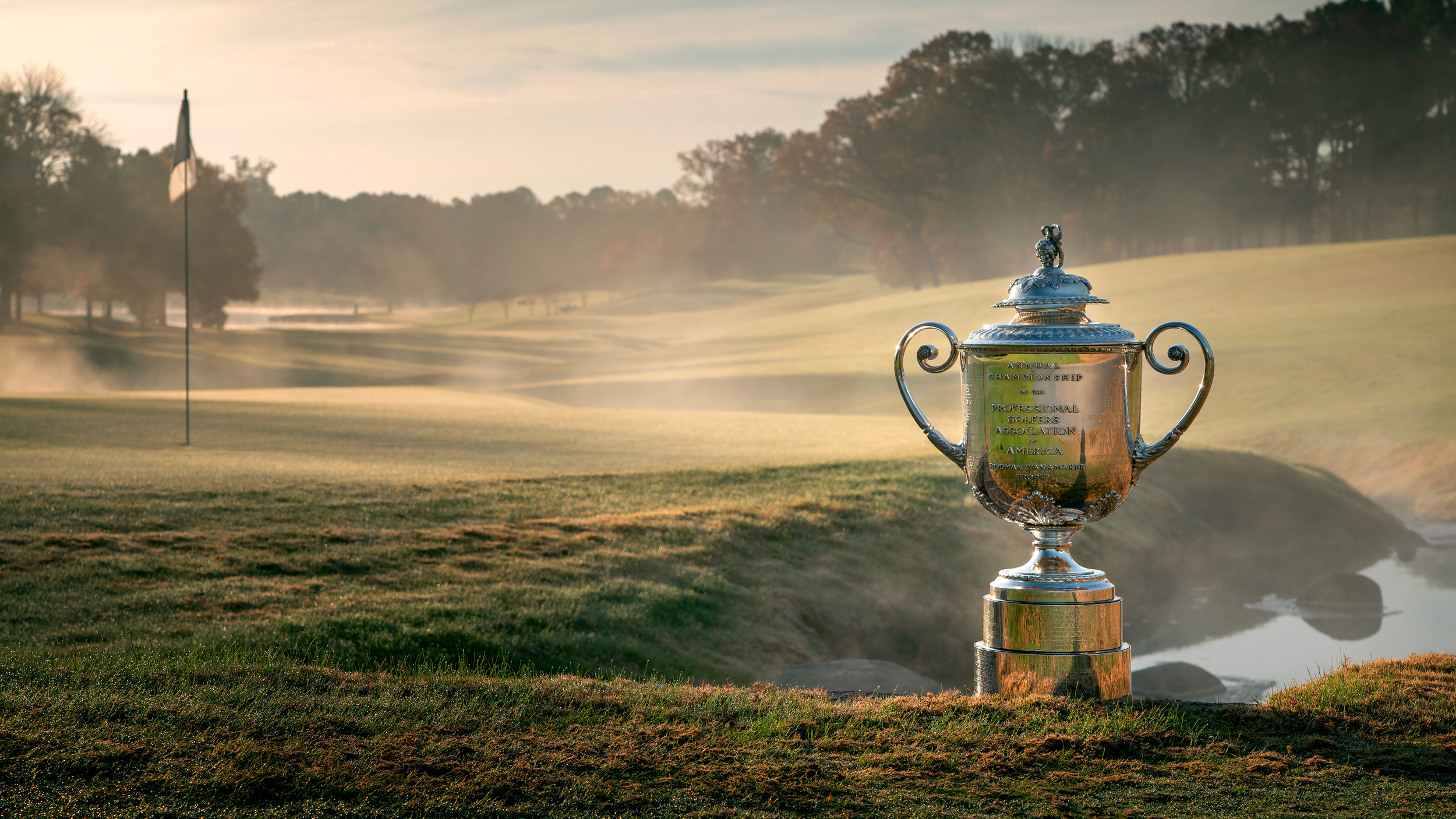 The Wanamaker Trophy by a green on a misty morning