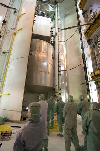 Photo of space shuttle Discovery's cargo bay showing its final payload: a closet for the International Space Station