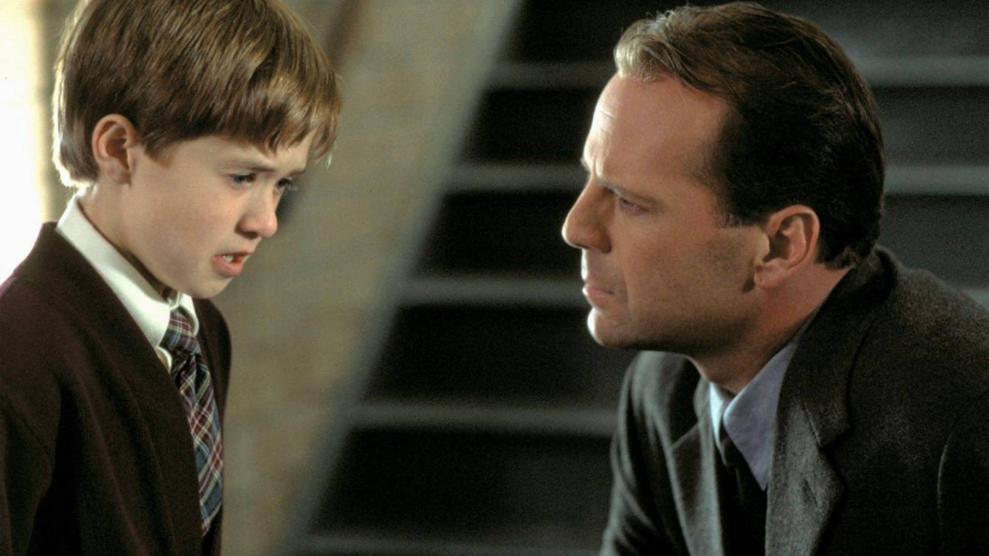 (L-R) Haley Joel Osment as Cole Sear and Bruce Willis as Malcolm Crowe in "The Sixth Sense"