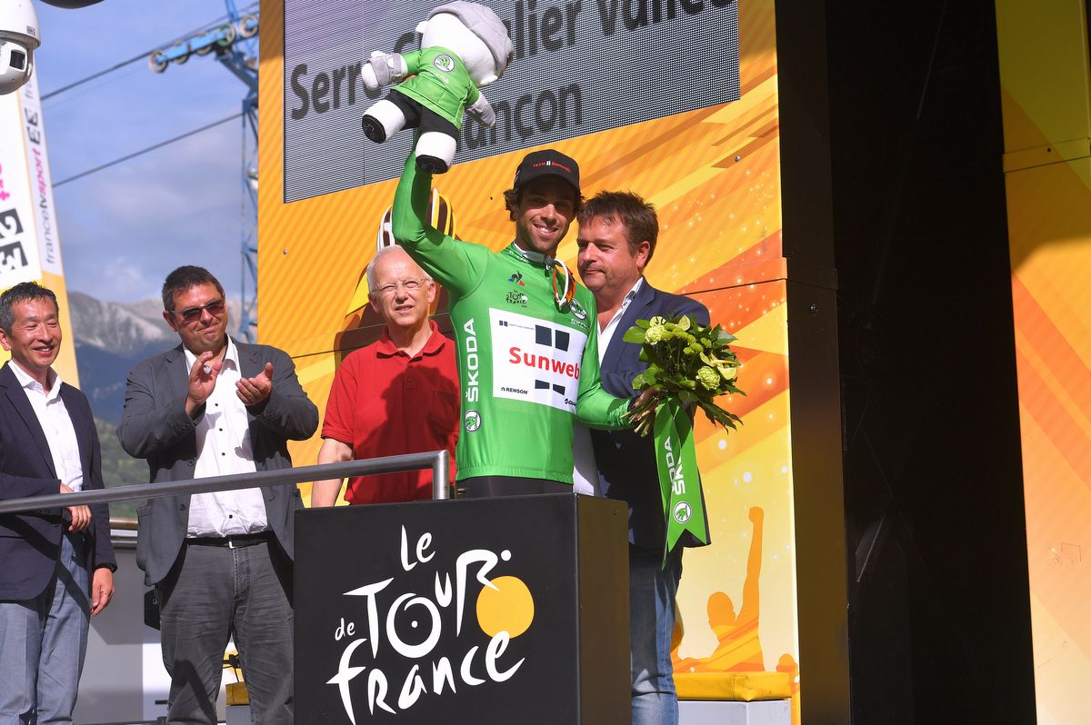 Michael Matthews (Team Sunweb) waves from the podium in the green jersey