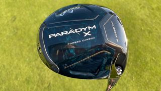 Callaway Paradym X Driver and its stunning carbon blue clubhead held aloft on the golf course