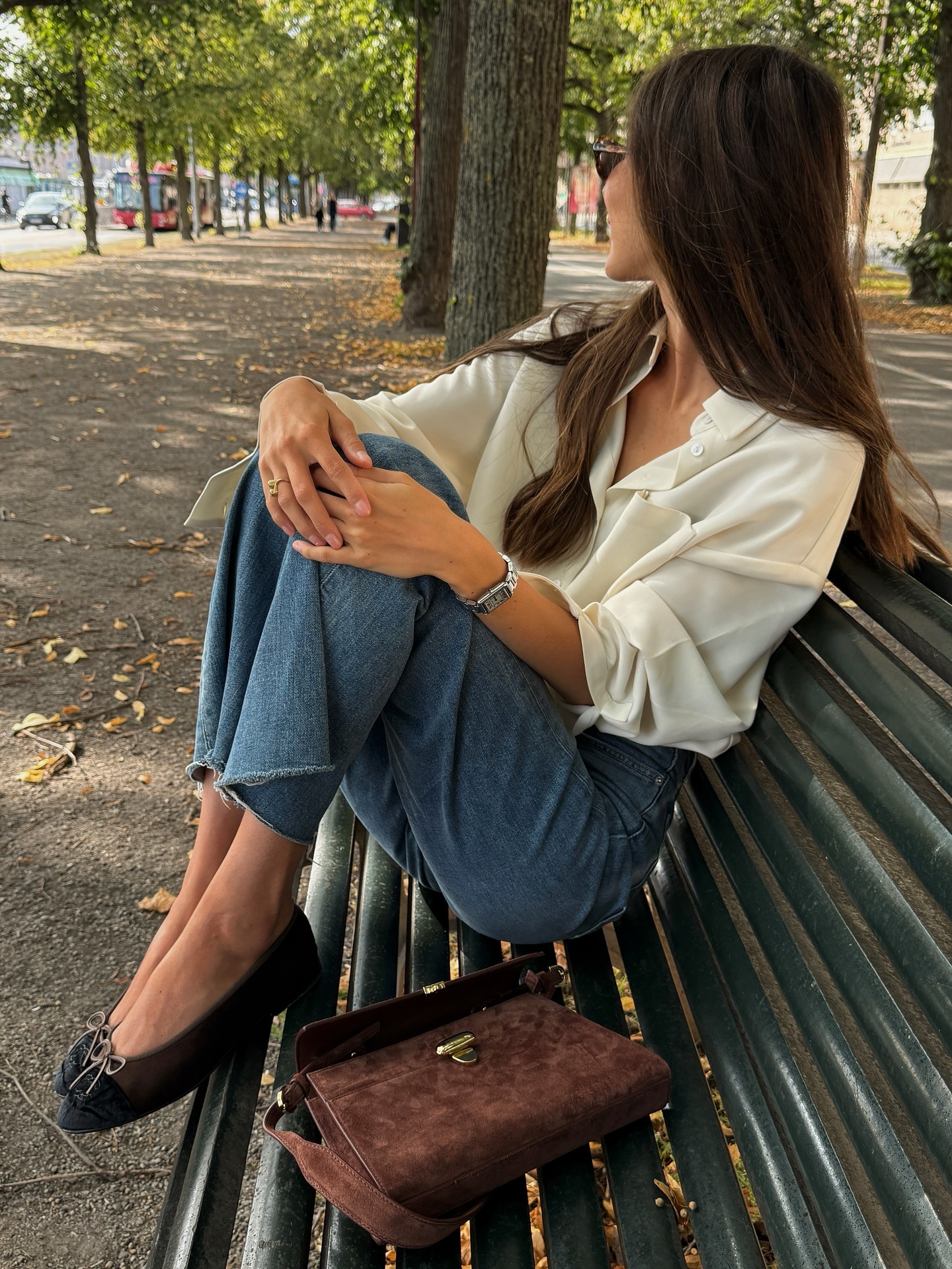 @fakerstrom wearing a silk shirt, jeans, and ballet flats.