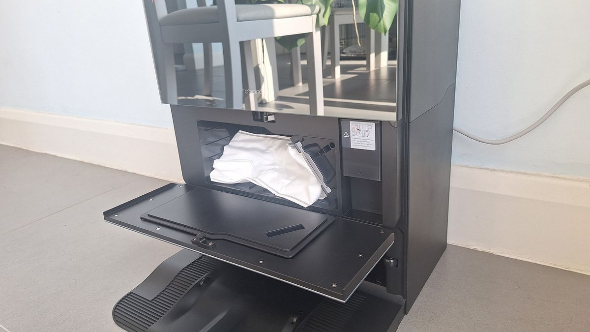 Roborock Saros 10 dock with front door open to show dust bag