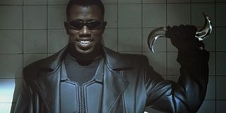 Blade Wesley Snipes smiling with a silver boomerang in his hand