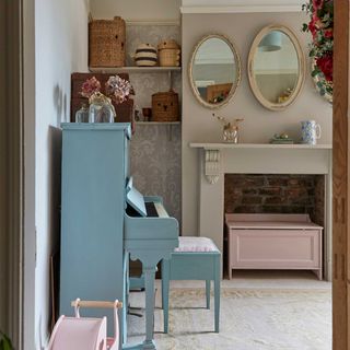 blue painted in a playroom with mirrors over a fireplace