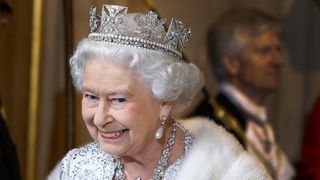 Queen Elizabeth II smiles as she leaves the State Opening of Parliament in 2018