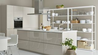 Neutral kitchen with freestanding white kitchen storage ideas along one wall