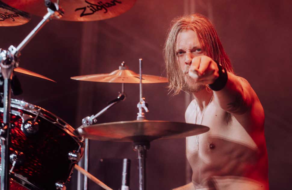 Rufus Taylor onstage, pointing at the camera