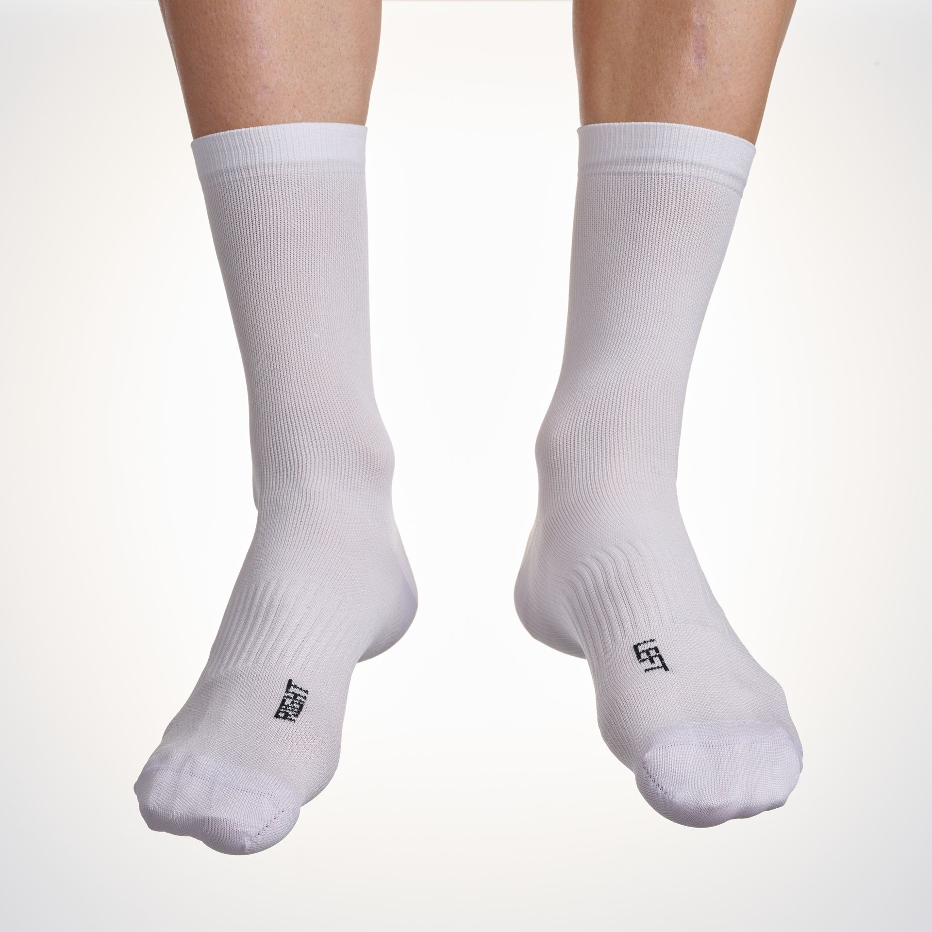 Male cyclist wearing the Assos Essence High cycling socks