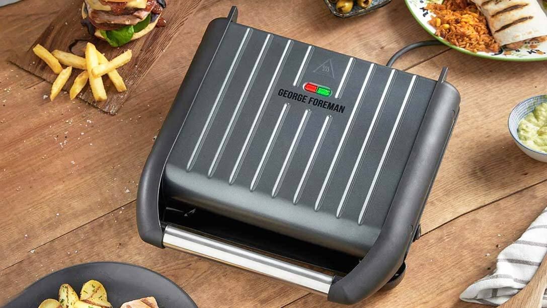 The George Foreman Grill surrounded by food