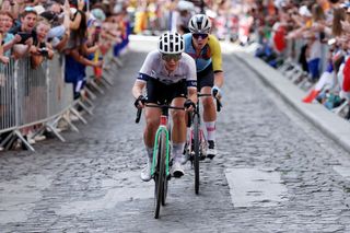 PARIS FRANCE AUGUST 04 LR Kristen Faulkner of Team United States and Lotte Kopecky of Team Belgium compete in the chase group during the Womens Road Race on day nine of the Olympic Games Paris 2024 at Trocadero on August 04 2024 in Paris France Photo by Alex BroadwayGetty Images