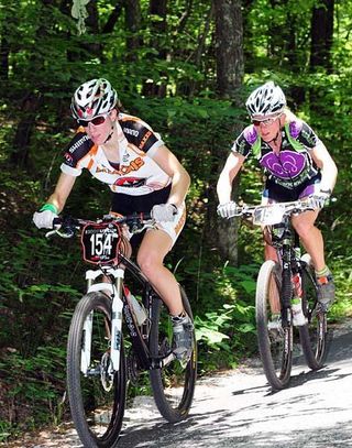 Lea Davison (Rocky Mountain/Maxxis) leads Sue Butler (MonaVie/Cannondale) on the pavement at the 2009 Bump