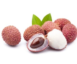 Lychee fruit whole and open to reveal the flesh and the seed inside