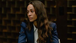 Zoe Saldaña looking to her left in Lioness.