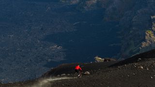 Richard Gasperotti riding down Mount Etna on his Mondraker Superfoxy