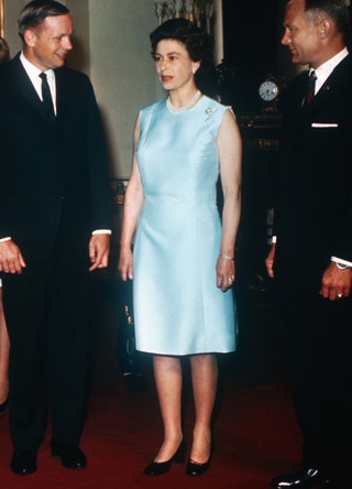 Queen Elizabeth II receives Apollo 11 astronauts (LTR): Michael Collins, Neil Armstrong, and Buzz Aldrin at Buckingham Palace as part of their world tour