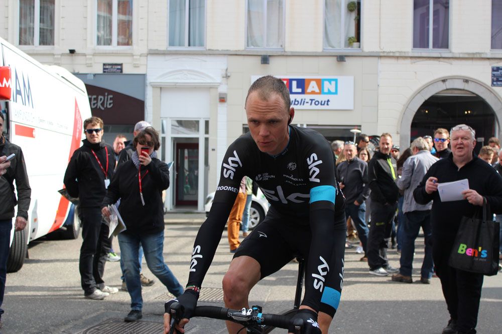 Chris Froome rides to sign on