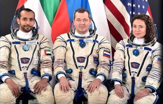 The International Space Station crew of Expedition 61/62, from left to right: UAE astronaut Hazzaa Ali Almansoori, Russian cosmonaut Oleg Skripochka, and NASA astronaut Jessica Meir.