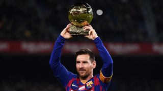 BARCELONA, SPAIN - DECEMBER 07: Lionel Messi of FC Barcelona holds up his sixth Ballon d'Or prior to the La Liga match between FC Barcelona and RCD Mallorca at Camp Nou on December 07, 2019 in Barcelona, Spain. (Photo by Alex Caparros/Getty Images)