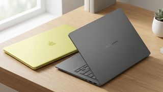 Apple MacBook Neo and ASUS Zenbook A14 on a wooden desk