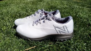 New Balance Fresh Foam X Defender SL shoes on grass