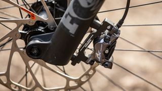 Closeup of brakes and fork on the Canyon Torque:ON CF 9 e-MTB
