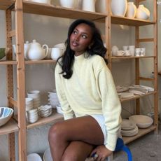 An image of a woman with curled hair.