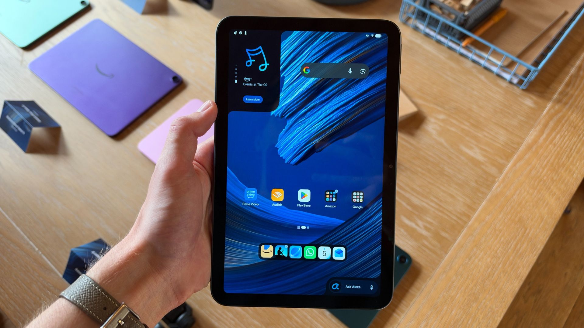 The Amazon Alexa Tablet 8 being held in the hand