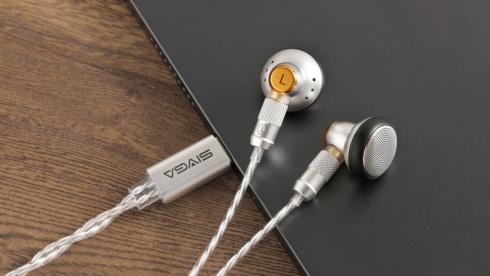 Sivga M260 HiFi wired earbuds in silver on the edge of a laptop