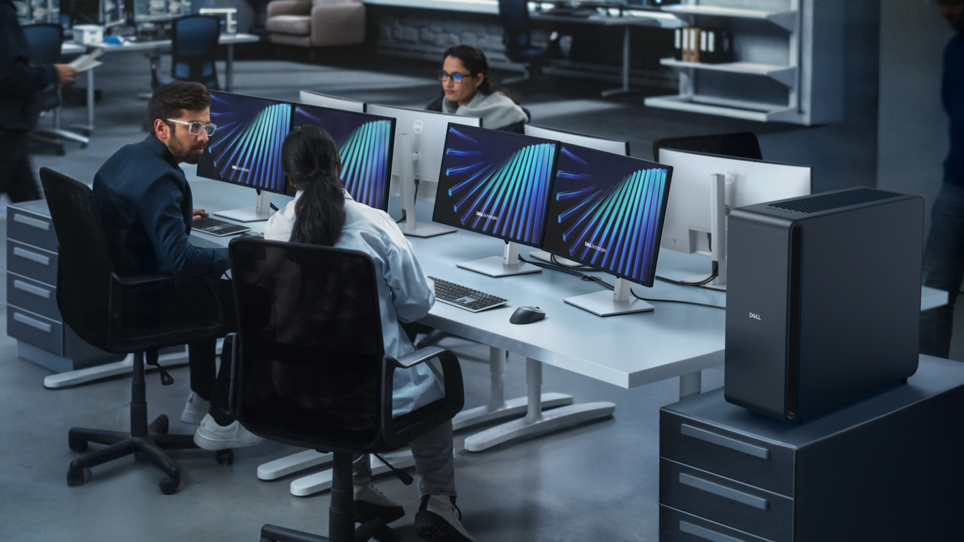Dell Pro Max alongside workers sat at desks