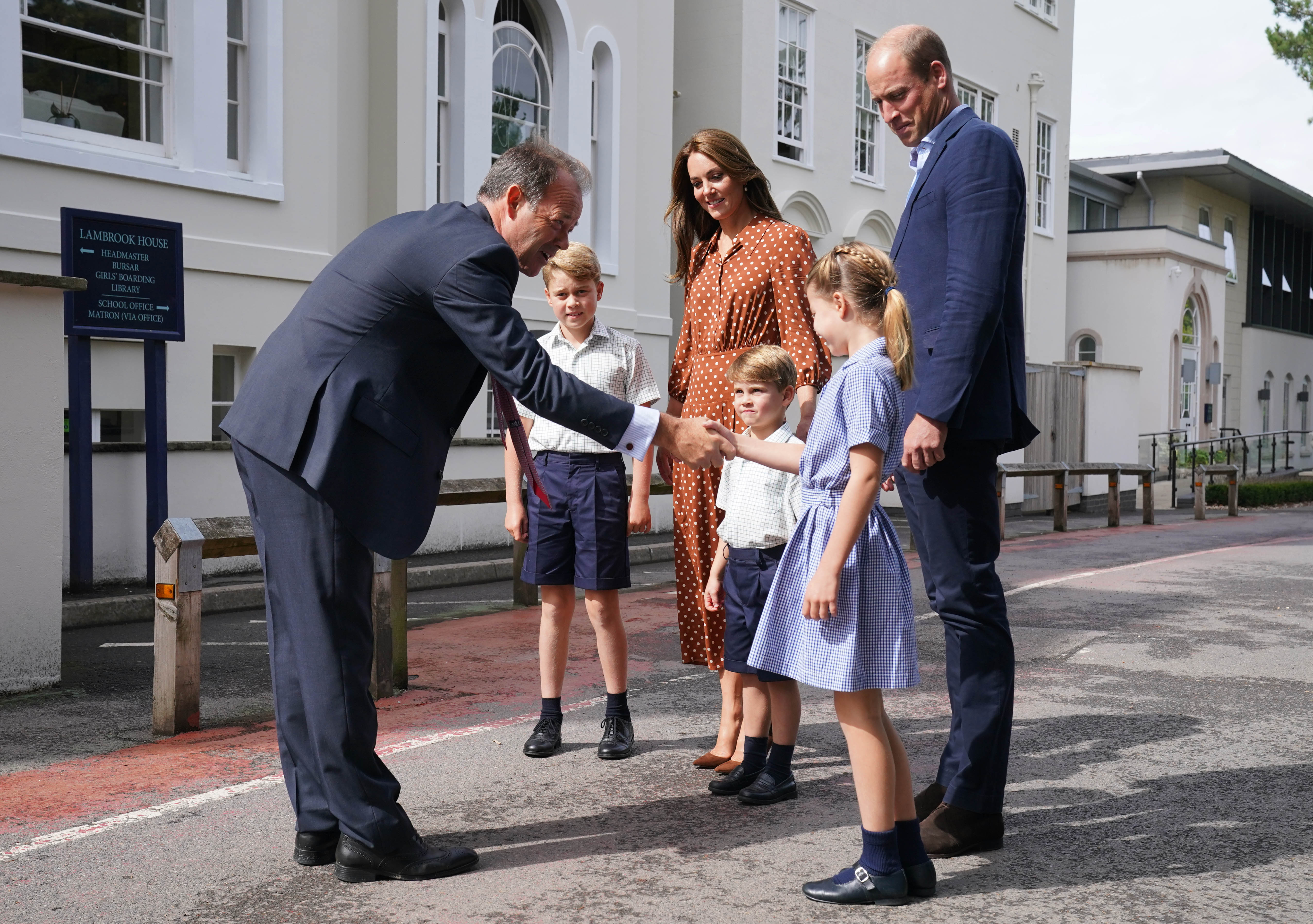 Prince George, Kate Middleton, Prince Louise, Princess Charlotte and Prince William meeting the headmaster on the first day of school
