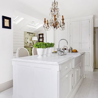 white kitchen with ceiling light