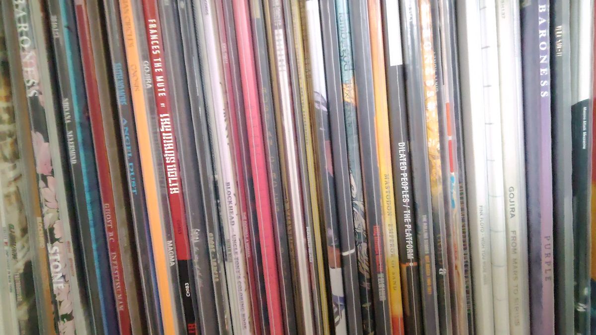 A close up of record sleeves stacked next to each other