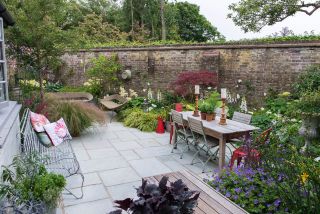 Garden designer Nic Howard used his creative skills to turn a compact courtyard into a haven bursting with colour and interest