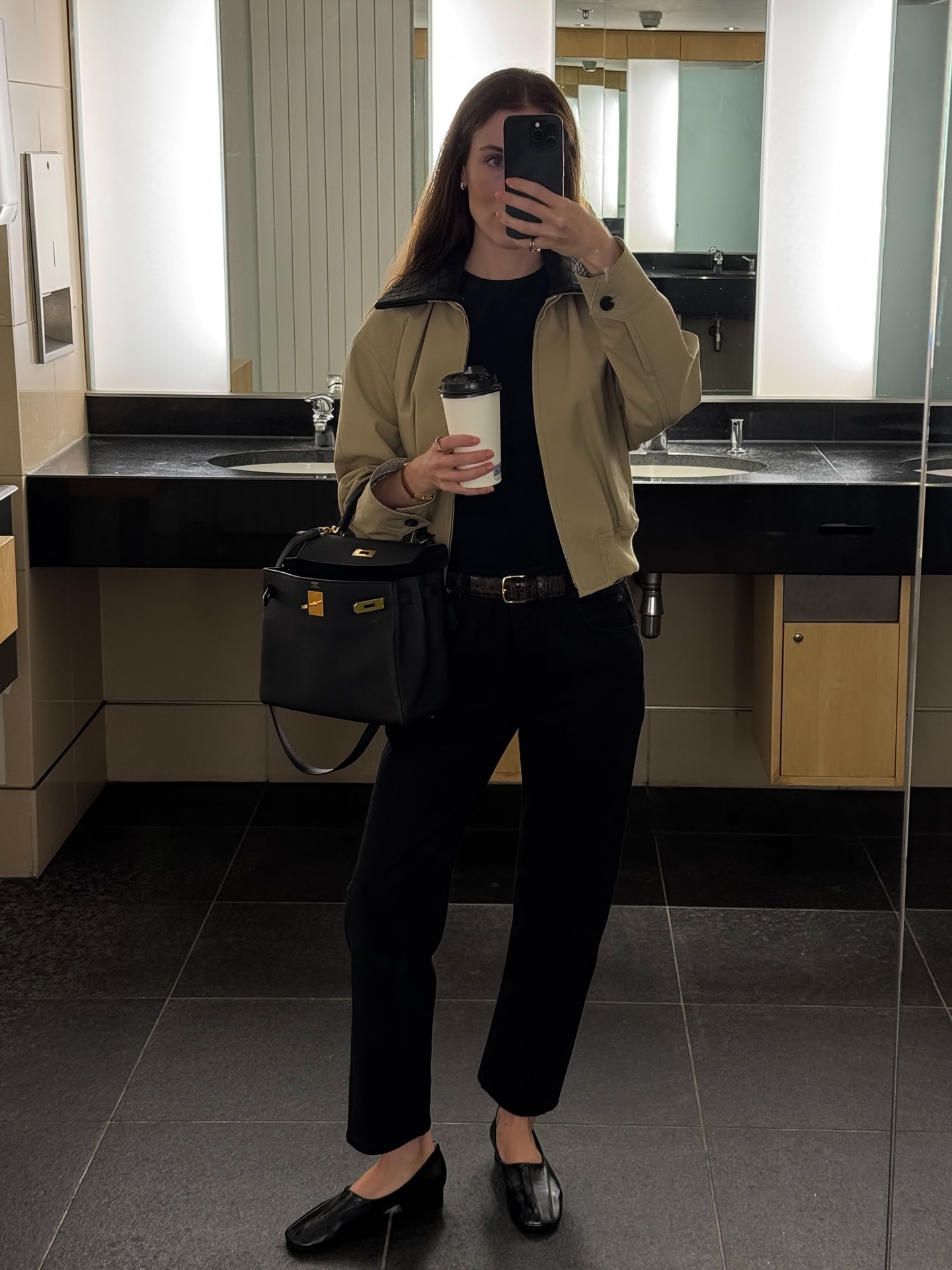 @annabelrosendahl wearing a Bottega Veneta bomber jacket, cigarette pants, and Phoebe Philo high-vamp pumps.