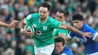 Hugo Keenan of Ireland running through players ahead of the Ireland vs Wales Six Nations 2024 round 3 match