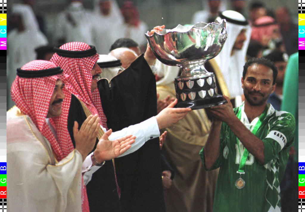 Saudi prince Sultan Ben Fahed (second left) awards the Asian Cup trophy to Saudi Arabia's captain after the team's 4-2 victory on penalties against the United Arab Emirates in the 1996 Asian Cup final in Abu Dhabi.