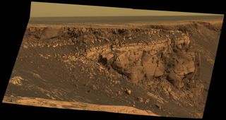 A view seen by Opportunity in 2007 as it was looking over the rim of Victoria Crater at one of the rocky promontories jutting out from the crater walls.