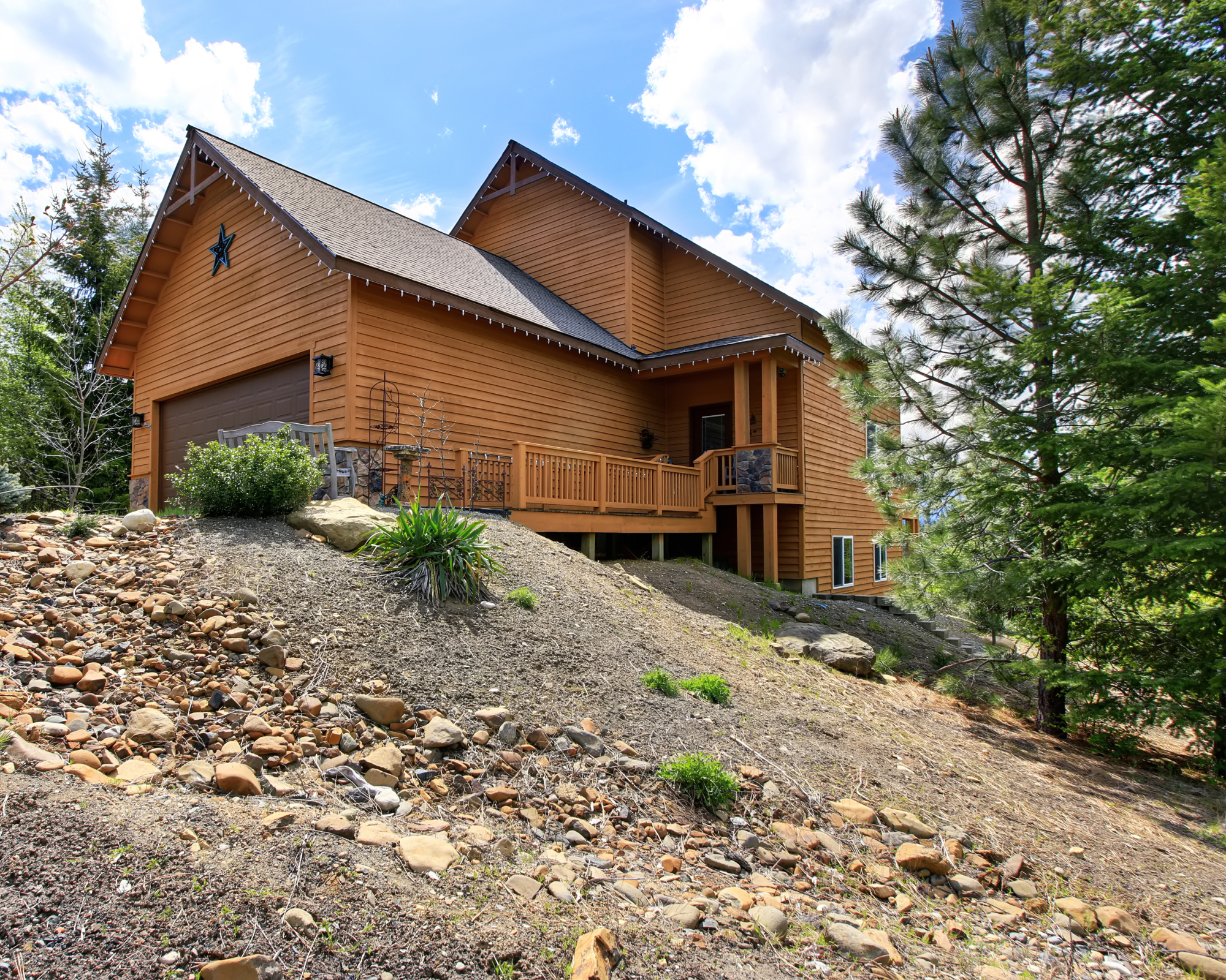 Eroding hill and house