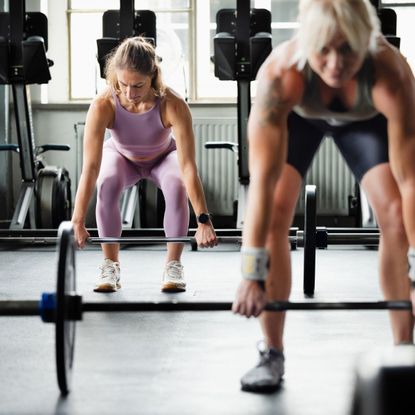 Best workouts for 4- year old women: Two women strength training in the gym