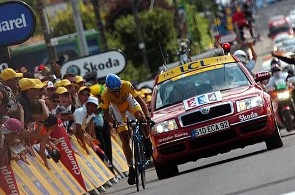 Alberto Contador gets constant encouragement from his team car