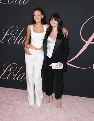Selena Gomez and Nicola Peltz Beckham arrives at the Premiere Of "Lola" at Regency Bruin Theatre on February 03, 2024 in Los Angeles, California.