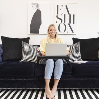 living room with frame on white wall and women work from home