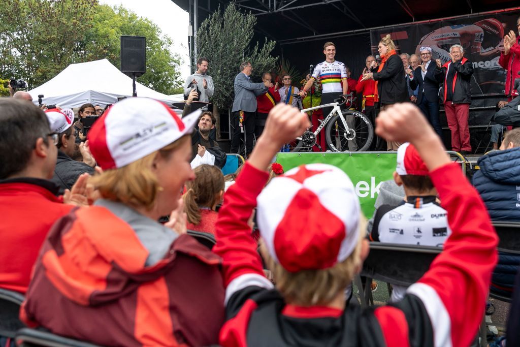 Remco Evenepoel pictured on the podium in front of lots of supporters at the celebration of world champion Evenepoel in Dilbeek and start of a big bike ride to Brussels Sunday 02 October 2022 22 years old Evenepoel from Schepdael Dilbeek became world champion after a great season with a win at the Vuelta first Belgian in 44 years to win a big tour BELGA PHOTO HATIM KAGHAT Photo by HATIM KAGHAT BELGA MAG Belga via AFP Photo by HATIM KAGHATBELGA MAGAFP via Getty Images